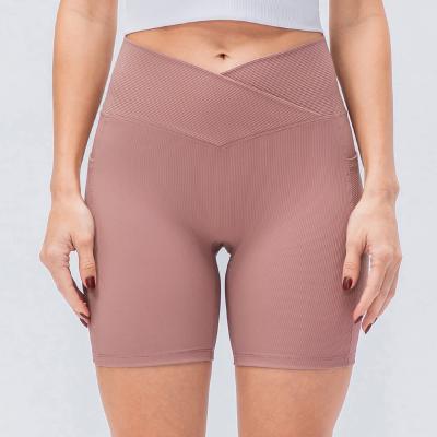 China Breathable Women Nylon Spandex Ribbed Biker Shorts With Pocket Waist High Waist Workout Cross Waist Yoga Shorts for sale