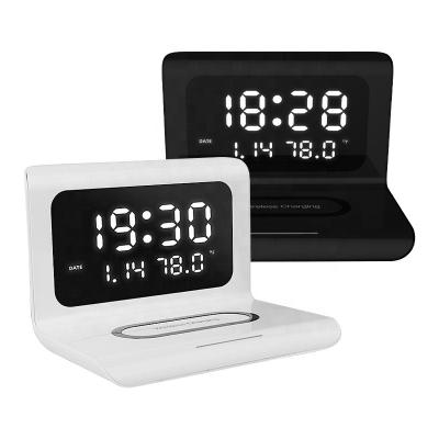 China Hot 2020 Mobile Phone Radios Charger Led Digital Display Desktop Alarm Clock Radio Pad Charging Clock For Smart Phone for sale