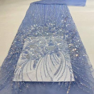 China New Sustainable Gorgeous Multicolor Beads Sequin Lace Embroidered High End Tulle Wedding Dress Fabric for sale