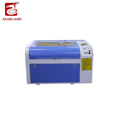 China Factory Price CO2 Water Cooled Laser 460 6090 PVC Acrylic Sheet Leather Laser Cutting Engraving Machine For Sales for sale