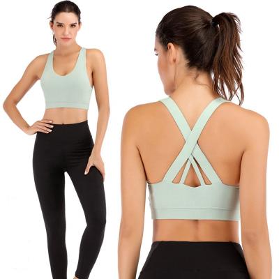 China Anti-Static Apparel Cross Back Workout Fitness Padded Yoga Wear Sports Bra For Women for sale