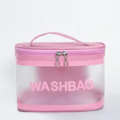 China 2022 Large Capacity INS Travel Storage Bags Transparent Frosted PVC Cosmetic Bag For Women's Portable Belt Hand Makeup for sale