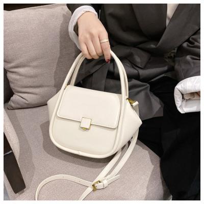 China 2021 Party Leisure Daily Gift Customized Simple Handbags Fashion Texture Cross Wholesale Shoulder Bag For Women Geometry Leather Handbags For Girls for sale