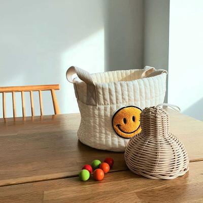 China Cute Smiley Face Embroidered Organizing Basket Baby Bottle Diaper Doll Storage Basket Simple Korean Style Central Institute of Statistics Package for sale