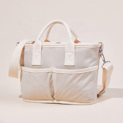 China Fashion 2022 autumn and new winter mom handheld bag cotton large capacity the bag maternity baby off the shoulder single cross - body bag for sale