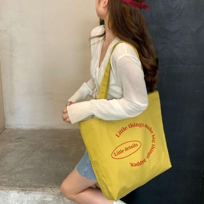 China Hot Sale Folding Women's Canvas Bags Large Capacity Supermarket Shopping Bags Travel Tote Bags for sale