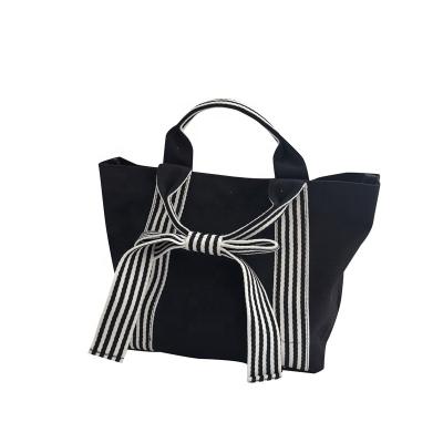 China Lady's Design Bow Canvas Bag Tote Dark Bag Small Fresh Female Handbag 2022 Fashion for sale