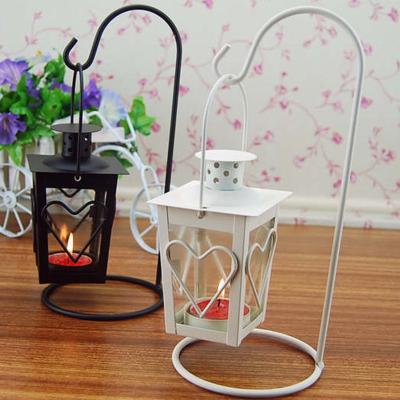 China Vintage Metal Mini Lantern European Wrought Iron Windproof Glass Lantern Lamp Decorative Minimalist Candle Holder Home Decor for sale