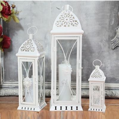 China Creative Home Crafts Living Room Style Retro Wrought Iron Wind Minimalist European Lantern Candle Holder Lace Up Handle Candle Holder Lantern for sale