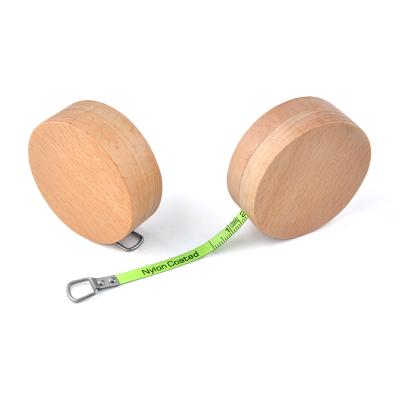 Cina Wintape Custom Round Wooden Mini Steel Tape Measure Stand Out From The Crowd 1m 3ft Fluorescent Green blade measurement in vendita