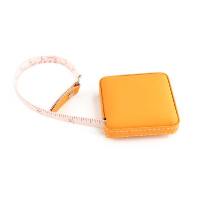 Chine Wintape le moins cher Centimètre PU en cuir Ruban à mesurer Coudre 150cm Vêtements circulaires Couleur orange vif Ruban à mesurer à vendre