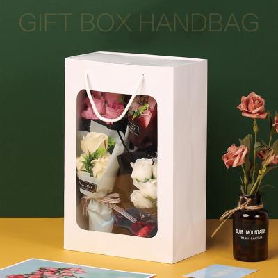 China Recyclable Portable Gift Rope Paper Fashion Square Transparent Paper Bag With Window for sale