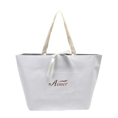 China Recycled Materials Customized Wholesale Reusable High Quality Paper Tote Bag Packaging for sale