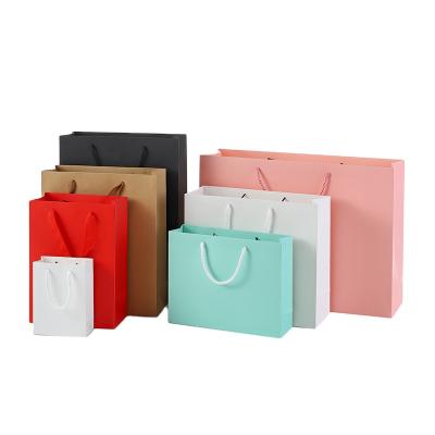 China Recycled Materials Wholesale Custom Paper Bags Thick Eco - Friendly Kraft Paper Bags Colored With Your Own Logo for sale