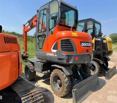 China Coreia Original Mini Excavatora Usada Doosan DX60W-9C Excavatora de Roda Pequena de 6 toneladas à venda