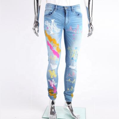 China Fashion Waterproof Trend Distressed Ripped Custom Light Blue Denim Skinny Paint Printed Jeans Men for sale