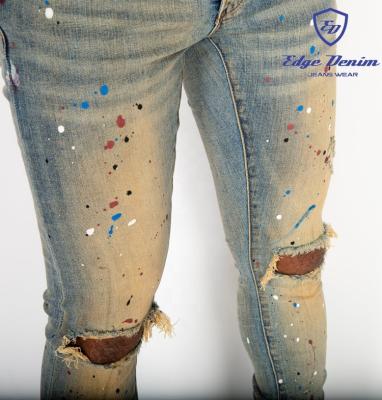 China Custom Skinny Edge Breathable Denim Jeans Pants Ripped Distressed Blue Western Vintage Paint Splatter Jeans China Factory for sale