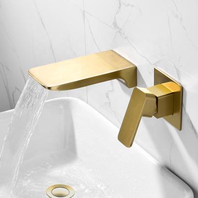 China Sense Faucets Swept Gold Waterfall Wall Mounted Basin Faucet With Drain for sale