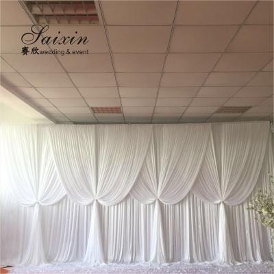 China New design double drape white cloth curtains cross valance for wedding Decorative backdrop zu verkaufen