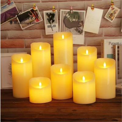 中国 Good quality event decoration real wax dripping dancing flame LED pillar candle 販売のため