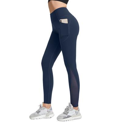 China Women Breathable Breathable Plus Size Yoga Leggings Tummy Control Workout Running Yoga Pants With Pockets for sale