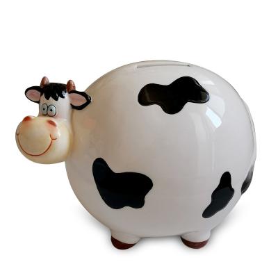 China Savings Bank For Coin Cow Design Money Bank Dolomite Cow Shape Savings Bank Handpainting Ceramic Coin Bank for sale