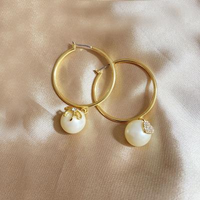 China Fashionable European and American fashion bow love pearl temperament wholesale asymmetrical round earrings for sale