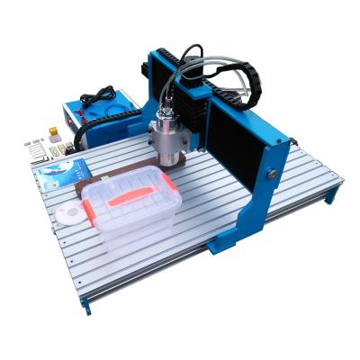 China CNC 6090 Stores 1.5KW 2.2KW Building Material Rail 4 Axis Linear CNC Router CNC 3D Engraving Machine Guide Milling Machine USB/Parallel Port for sale