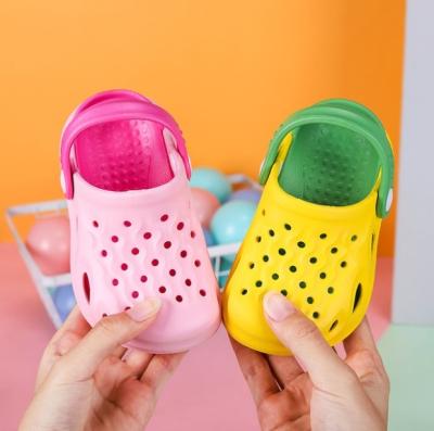 China Quick-Drying Wholesale Price Kids Spring Kids Clogs Summer Baby Slides Slippers Garden Shoes for sale