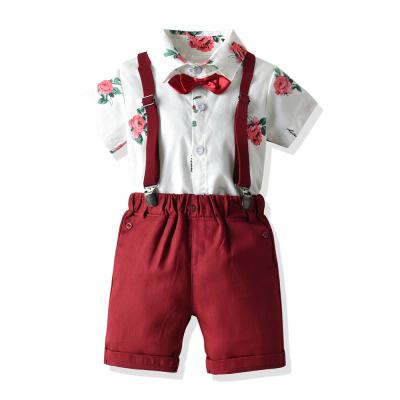 China 2022 casual new spring and summer one year old set printed short sleeve and shorts toddler boys clothing sets with two color straps for sale