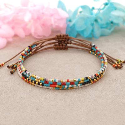 China FASHIONABLE New Daily Thanks Rice Glass Beads Hands - Woven Rainbow Friendship Rope with Extra Small Bracelet for Women for sale