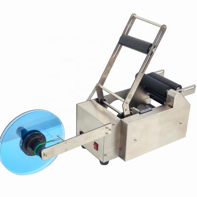 China MT50 Food factory price round bottle labeling machine Semi-automatic semi-automatic labeler label packing machine for sale