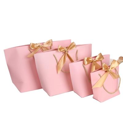 China Customized Kraft Paper Logo Printed Colorful Pink Paper Bag Gift Shopping Bag With Ribbon Handle Ribbon Paper Bag for sale