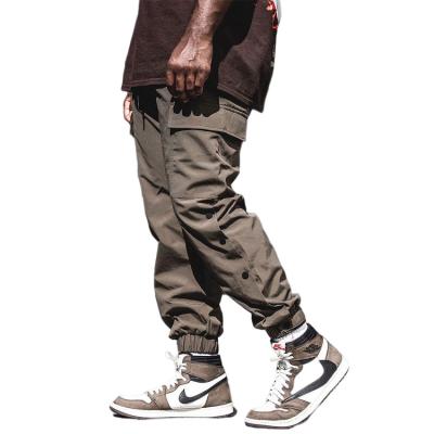 China High Quantity Men's Breathable Pants Button Side Cargo Pants Elastic Waistband Men's Stacked Sweatpants for sale