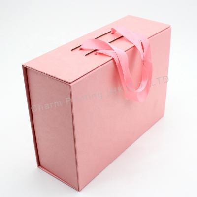 China Large Gift Packing Box Pink Recyclable Magnetic Portable Sliver Wig Magnetic Eyelashes Packaging Cardboard Boxes Folding for sale