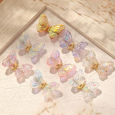 China Eco-friendly Material Nail Beauty Butterfly Ornament Smart Flying Colorful Aurora Glitter Butterfly Nail Drill Decoration for sale