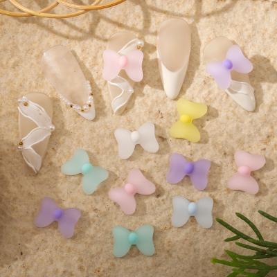 China Manicure Eco-friendly Material Bowknot Frosted Transparent Three-dimensional Cute Color Bowknot Nail Decoration for sale