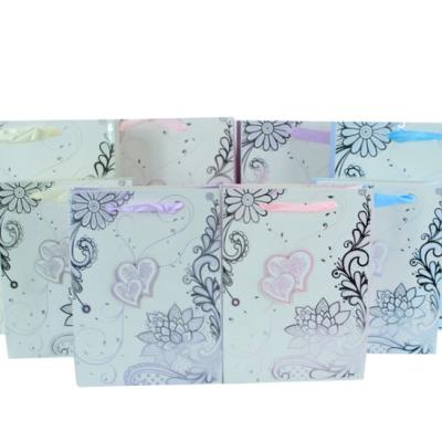 China New Pattern Handmade Gift Bag With Flowers Gift Bag With Color And Gold Stamping Bag for sale