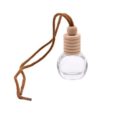 China 5ml Custom Hanging Car Diffuser Bottle With Wooden Cap For Car Perfume Oil Glass Bottle for sale