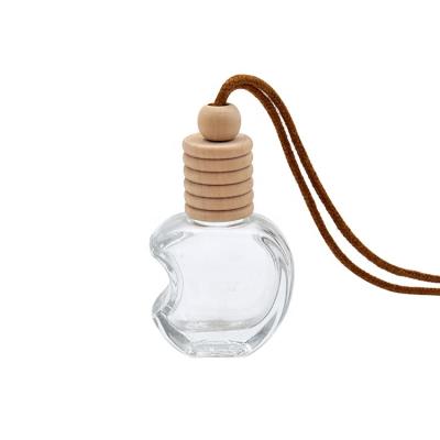 China 10ml Order-Friendly Apple Shaped Hanging Car Perfume Bottle Car Air Freshener With Cap Glass Wood Bottle for sale