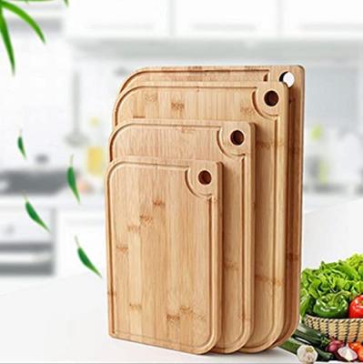 China Eco-Friendly End Disposable Vegetable Grain Fish Chop Fruit Sanda Black Wood Cutting Chopping Board Cutting Plate With Drip Groove for sale