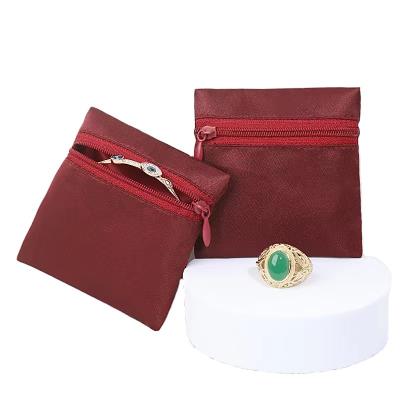 China Factory direct sales high quality solid color zipper jewelry bag durable dustproof jewelry storage bag for sale