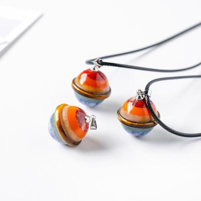 China BOHEMIA Ot Selling Natural Saturn Crystal Leather Rope Planet Crystal Ball Gemstone DIY Seven Color Necklace DIY Jewelry Pendant for sale