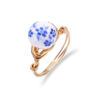 China New casual/sports literary and artistic temperament printed enamel Ring Simple Glass Flower Female court ring for sale