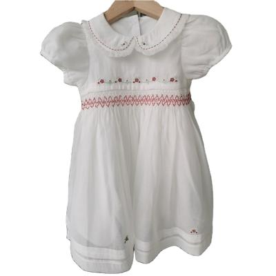 China Breathable Kids Clothes Girls Daily Wear White Floral Hand Print Smocked Girl Dress for sale