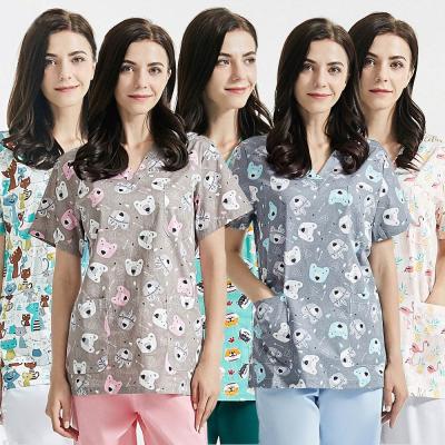 China Hospital grooming work uniform tops+pants cartoon printing scrubs tops lab hospital work wear men and women groom uniform custom for sale