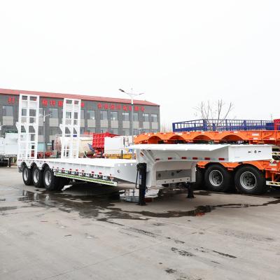 China Semi remolque de cuello de ganso con 4 ejes remolque de transporte de cama baja en venta