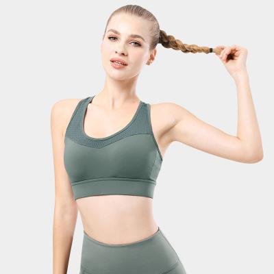 China Breathable Custom Fitness Girl Strappy Sports Bra Backless Medium Support Sexy Running Yoga Bra With Removable Cups For Women for sale