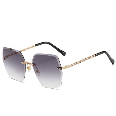 China 2020 rimless new vibrant style, compact, luxurious, high quality summer unisex sunglasses for sale