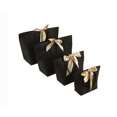 China Recycled Materials Wholesale Black Paper Gift Bags With Ribbon Bowknot for sale